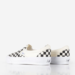 Checkered vans slip ons black and white best sale